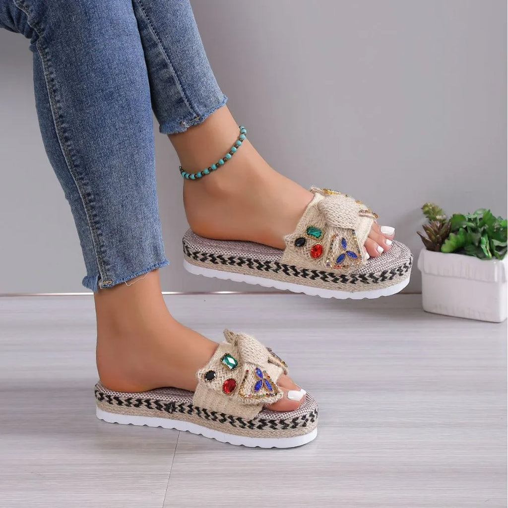 Creamy-white women's platform sandals with a cloth upper, round toe, and a decorative beach bow.