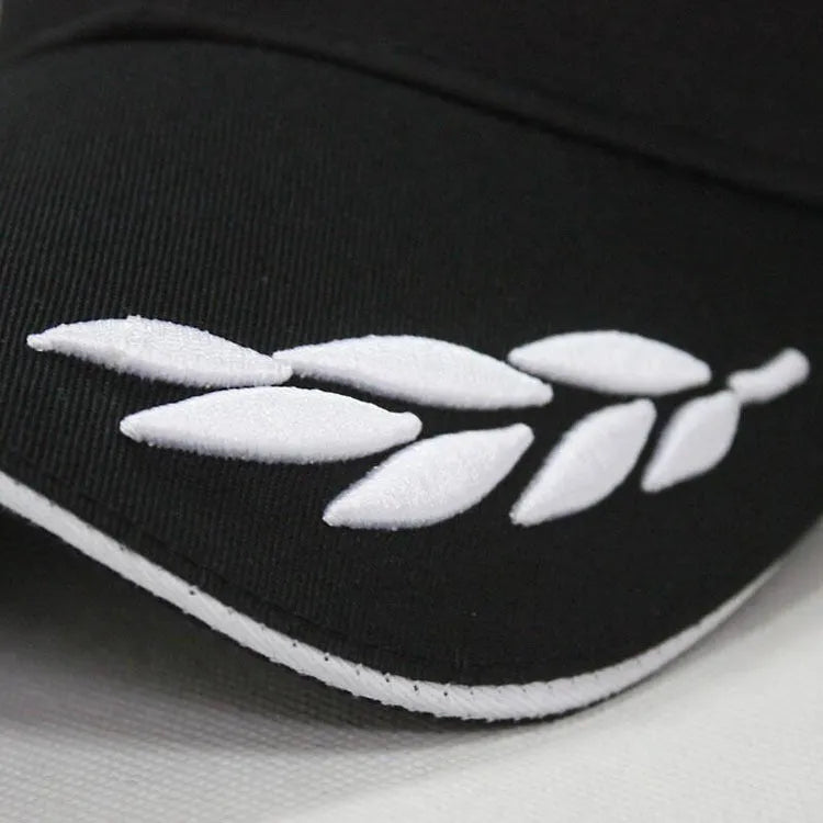 Black canvas baseball cap with embroidery and adjustable closure on a neutral background