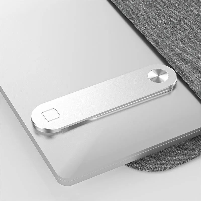 Black aluminium magnetic phone holder mounted on side of laptop screen.