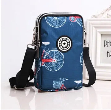 Vertical mobile phone bag in black with Oxford Spinning texture and zipper closure