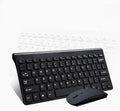 Black wireless keyboard and mouse set with USB receiver on wooden desk