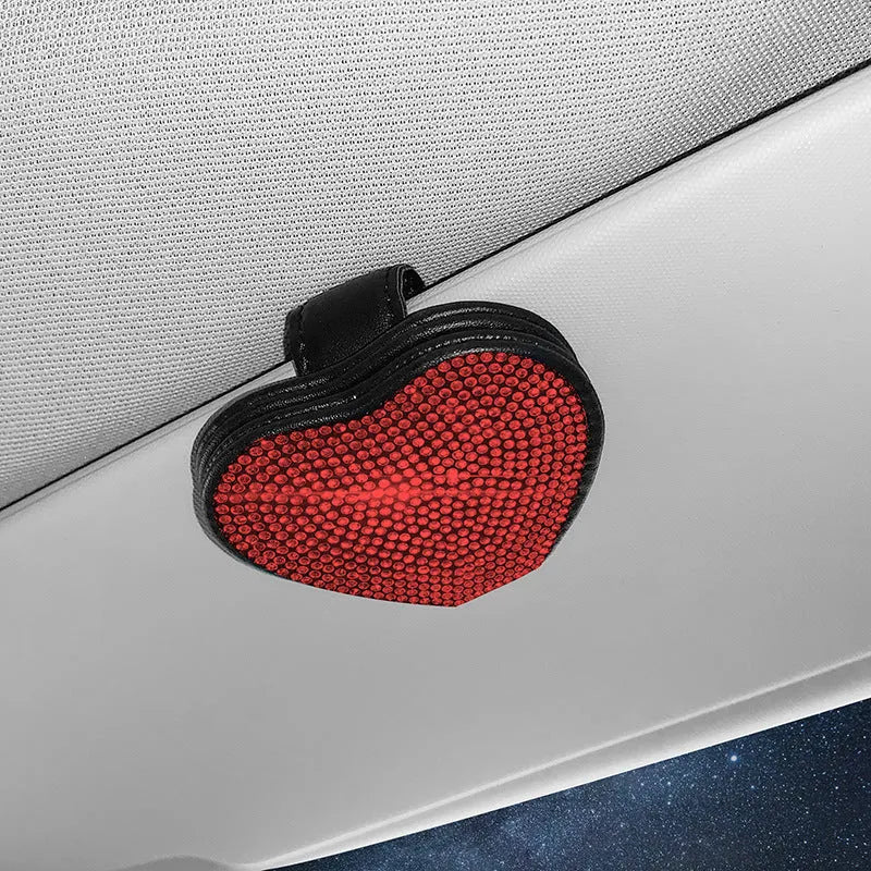 Black PU leather magnetic storage clip with diamond encrustment, shown attached to a car sun visor.
