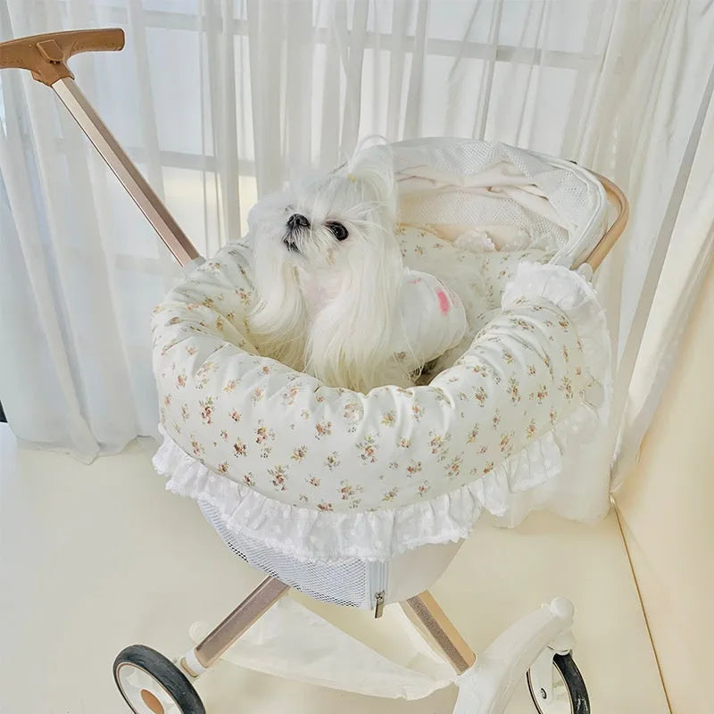 A green grey striped towel, cushion, and pillow set for a pet stroller, shown removed and ready for washing.