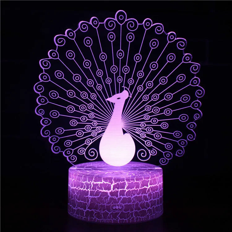 Small blue 3D acrylic USB table lamp with cracked base design lit up on a wooden desk.