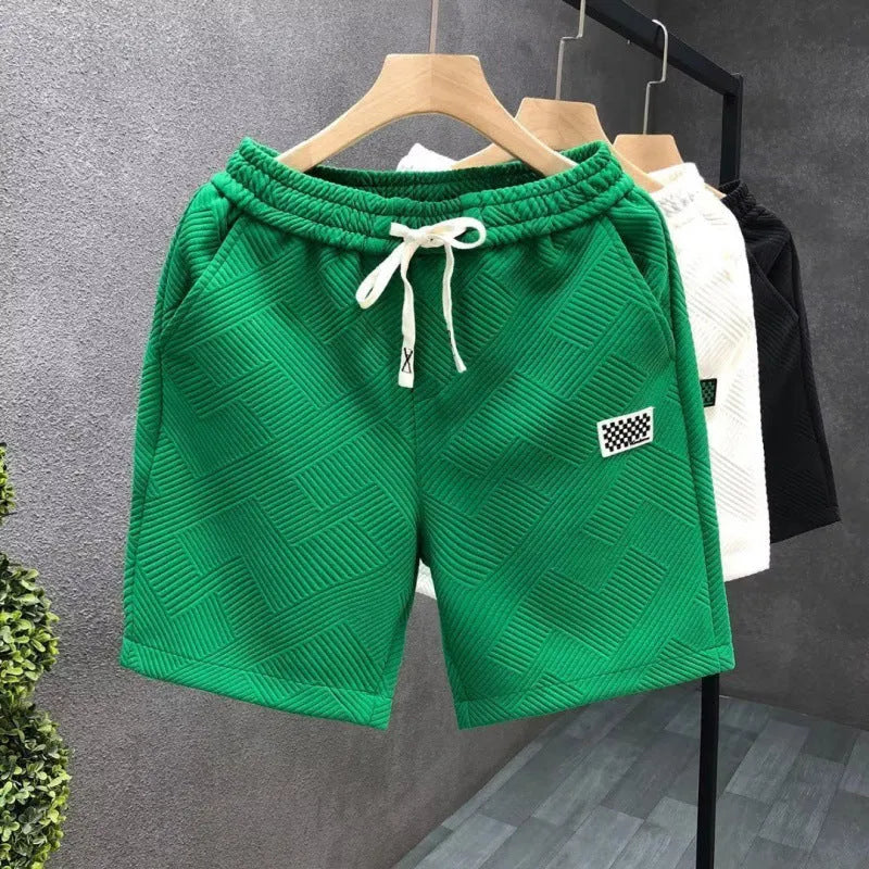 Men's solid colour casual sports shorts with micro elasticity in white, black, or green options