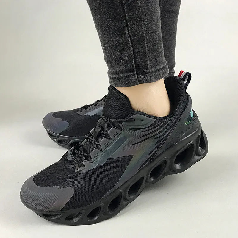 Men's low-top casual sports shoe in black with mesh upper, round toe, and lace-up front.