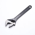 15-inch stainless steel adjustable open-end wrench with a blackened head and ergonomic handle.