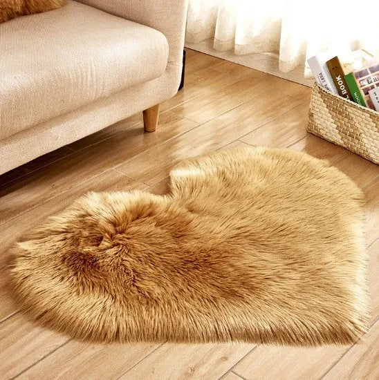 Heart-shaped plush carpet in multiple colours showing wool-like texture with 5-6 cm pile length