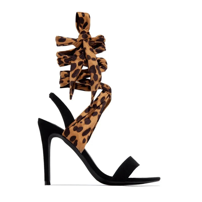 Light brown women's leopard print high heel sandals with cross-straps and a thin 8cm heel.