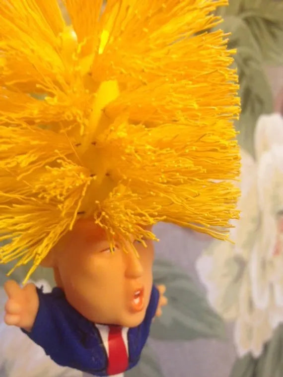 Yellow plastic Donald Trump toilet brush with 40cm length and hanging slot handle