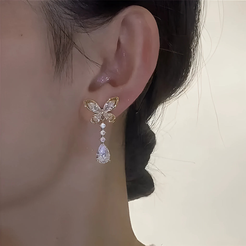 Platinum colour bow stud earrings with electroplated finish on zinc alloy