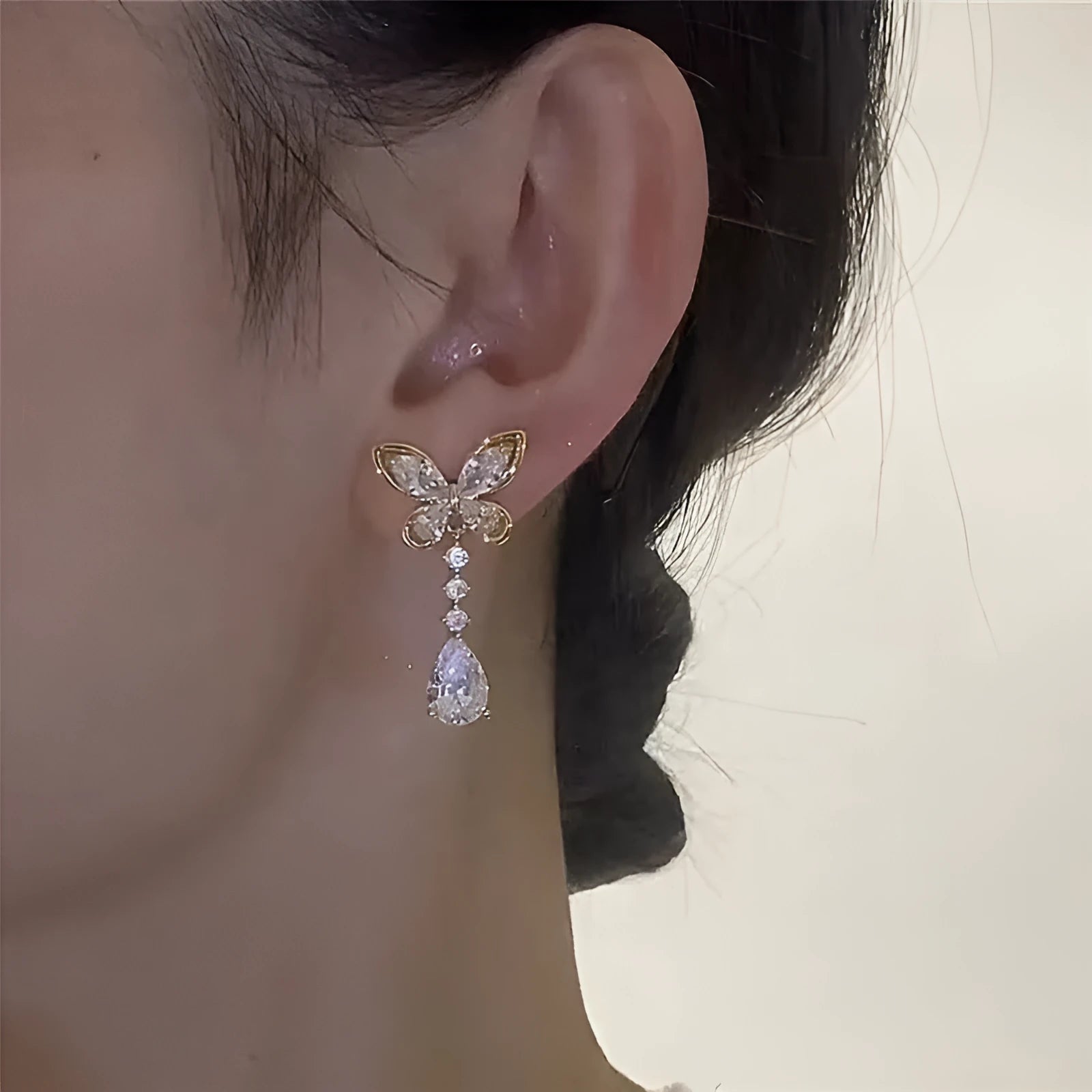 Platinum colour bow stud earrings with electroplated finish on zinc alloy