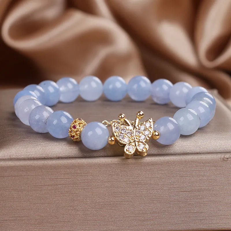 Sky blue butterfly crystal bracelet for women with pearls, rhinestones, and sequins on a 17cm chain.