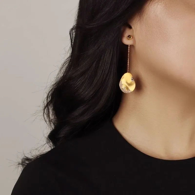 Asymmetric Chinese style earrings with gold-plated finish and zircon flower design in silver tone