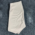 Women's high-waisted yoga shorts in quick-dry nylon, shown in a selection of available colours.