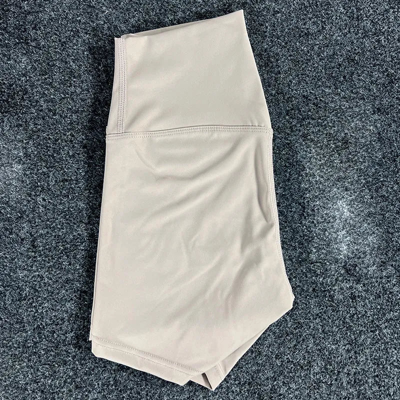 Women's high-waisted yoga shorts in quick-dry nylon, shown in a selection of available colours.