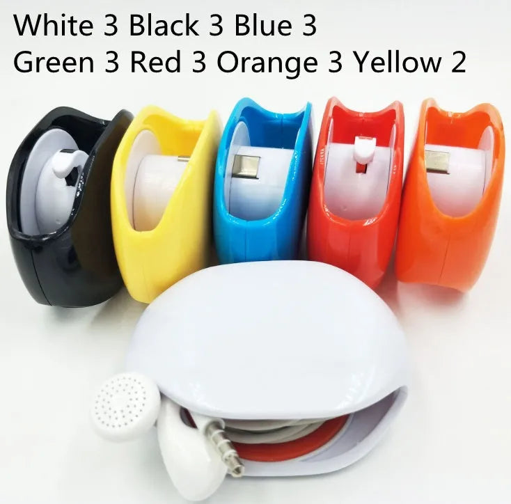 Automatic plastic cable winder retractor showing black, blue, and red units next to a coiled earphone cable.