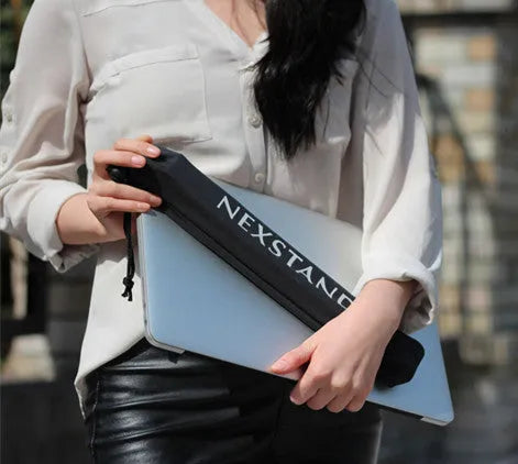 Black folding portable laptop stand made of reinforced nylon, shown open and folded to 4cm depth.