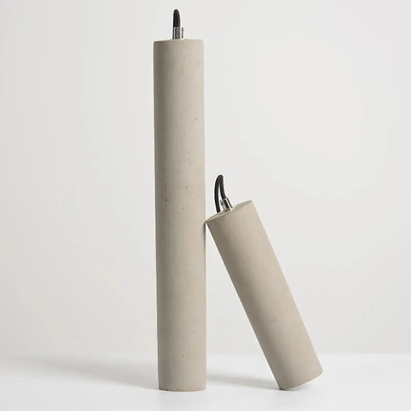 Cement industrial bedside droplight with water pipe design, glossy finish, on a wooden table