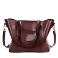 Retro-style brown PU messenger bag for women, shown with an A4 magazine inside to demonstrate capacity.