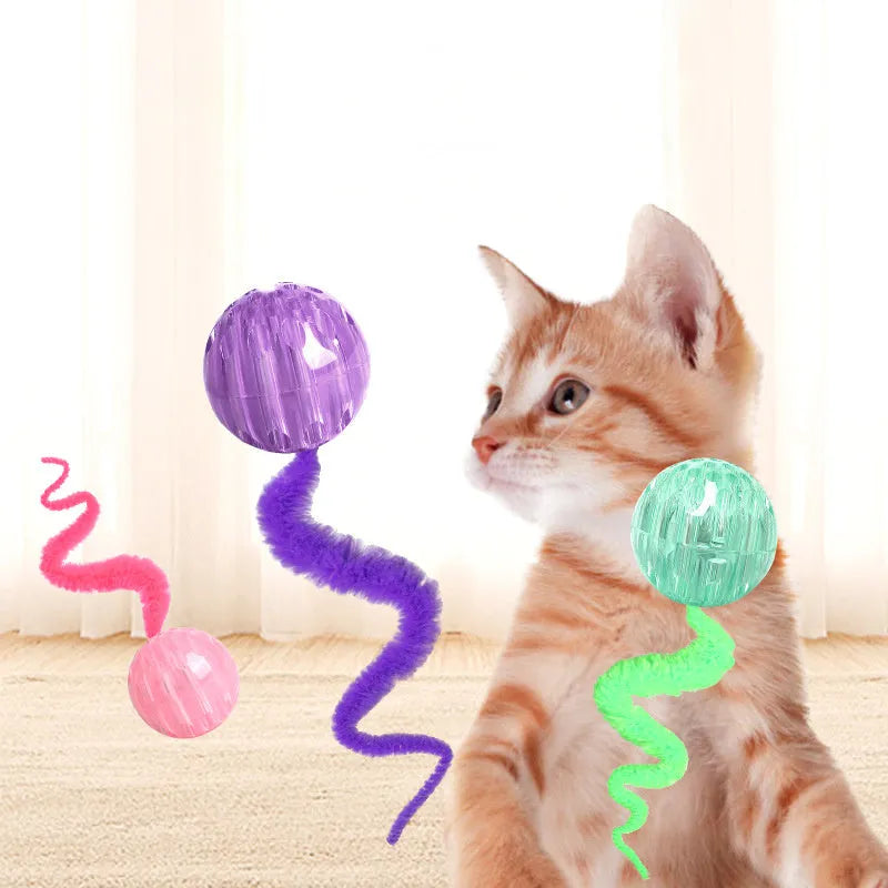 Interactive TPR bouncy ball cat toy with soft plush worm tail in green, pink or purple