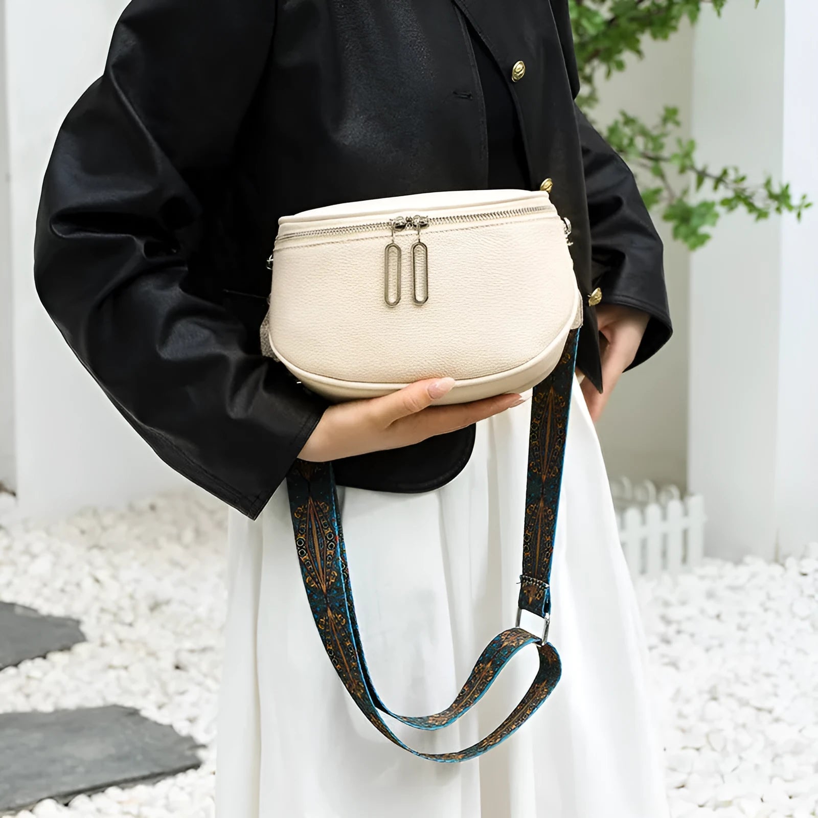 Women's soft PU leather messenger bag in saddle shape with single strap and internal zipper compartment