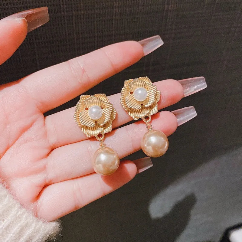 Gold electroplated floral stud earrings with opal stone and sterling silver posts in Hong Kong style design