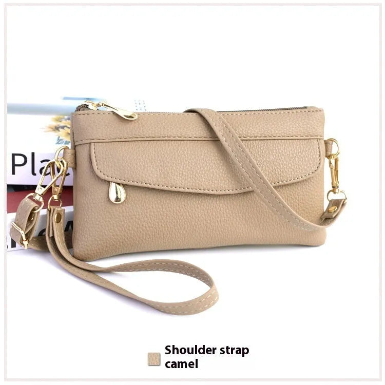 Soft PU leather crossbody bag in a square shape showing the internal sandwich zipper pocket.