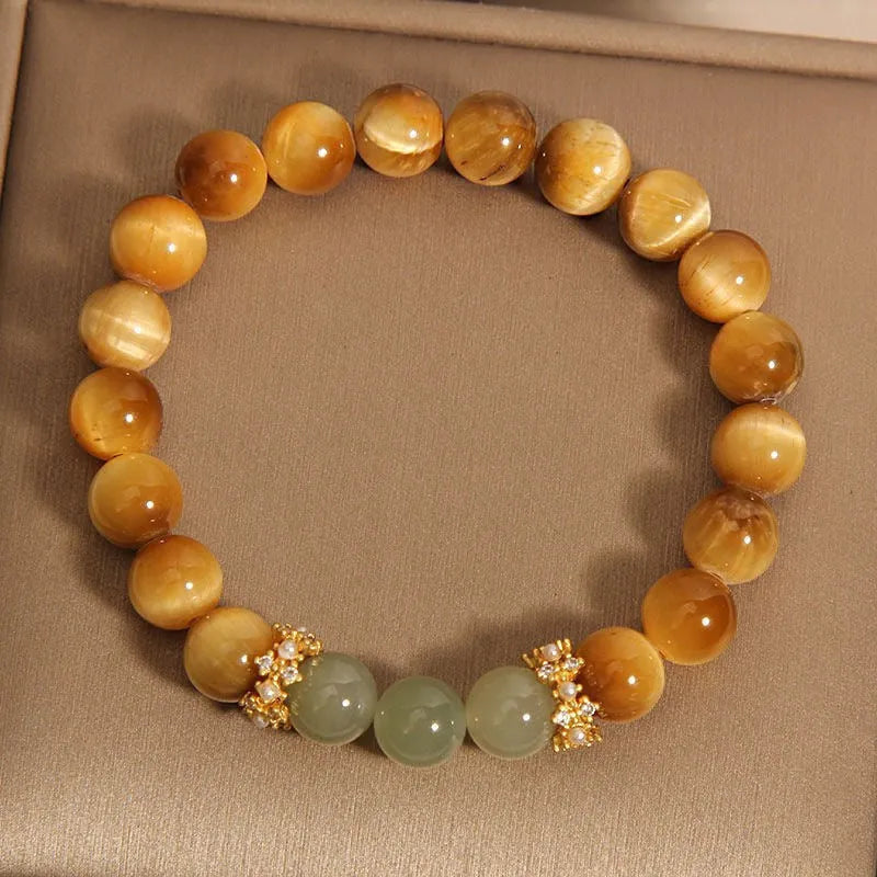 Natural yellow tiger's eye stone bracelet showing golden gourd, bamboo joint, and lace pattern variations