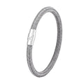 Geometric titanium steel wire bracelet with hidden magnetic clasp on a wrist, showing matte grey finish.
