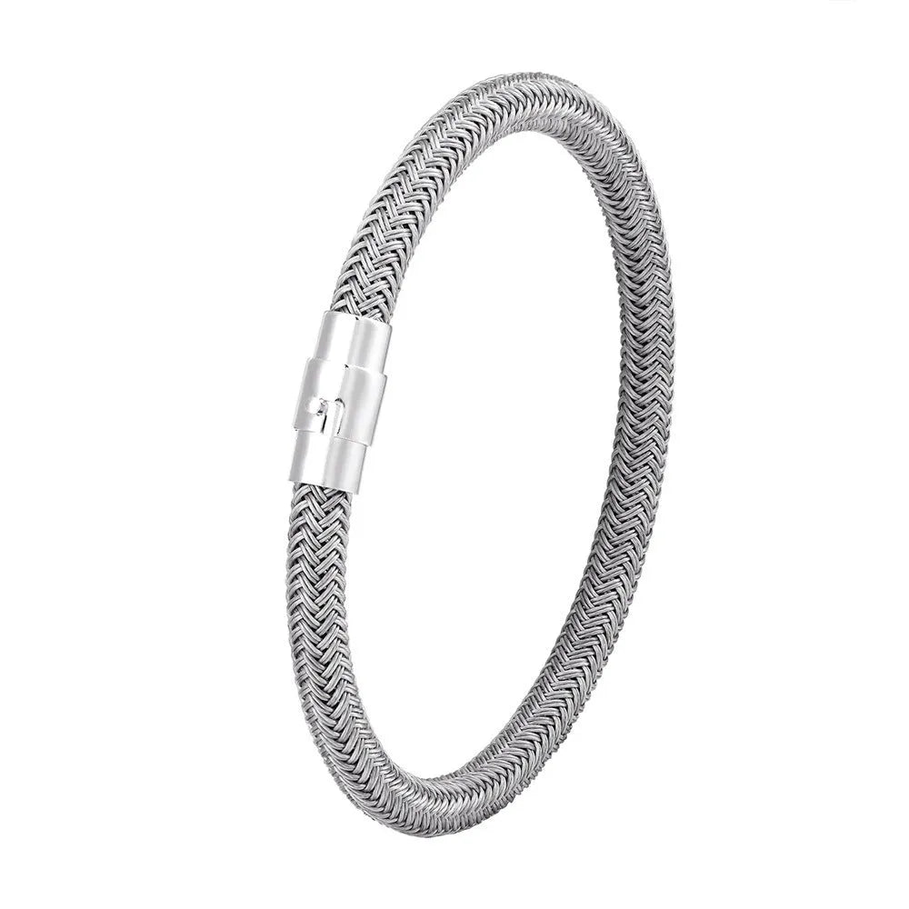 Geometric titanium steel wire bracelet with hidden magnetic clasp on a wrist, showing matte grey finish.