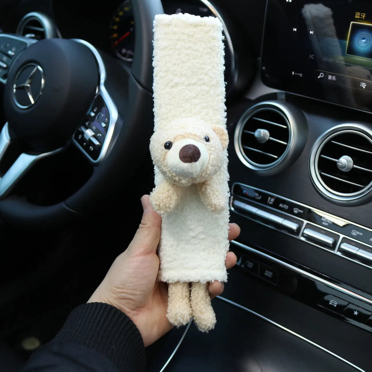 Cartoon plush seat belt shoulder protector in lamb wool with bear and rabbit designs.