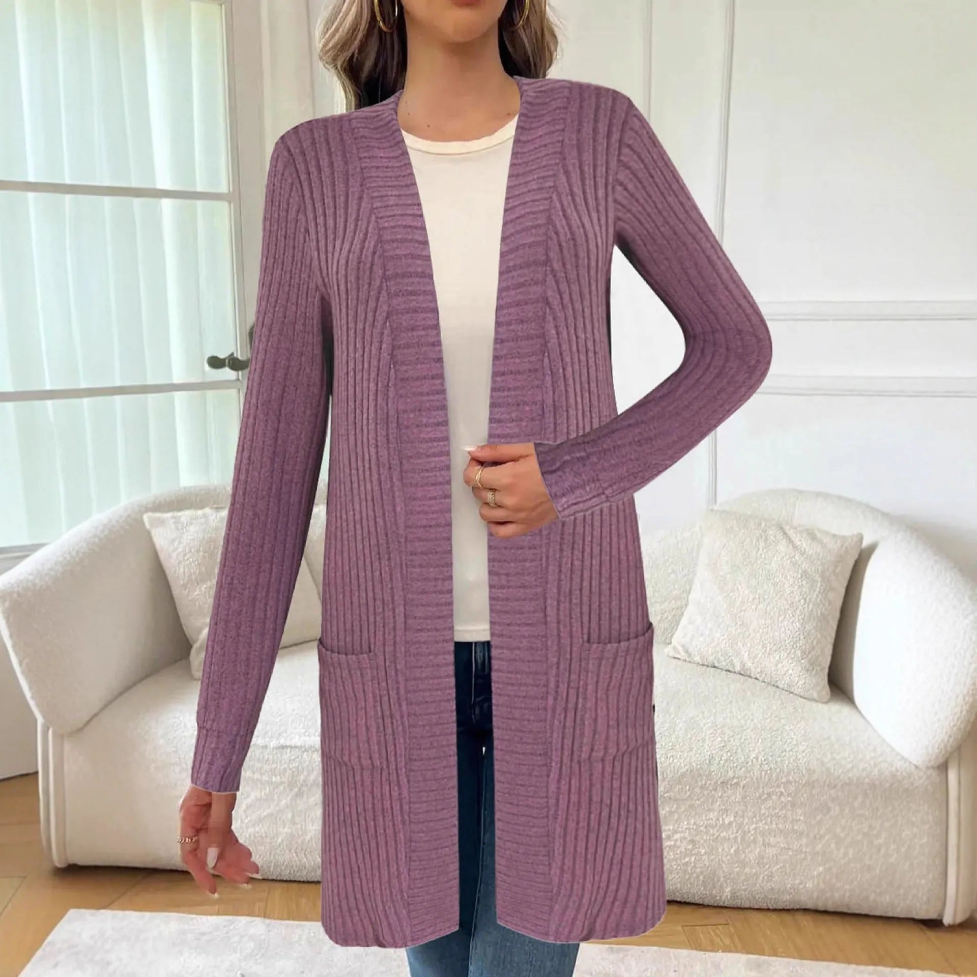 Long sleeve loose cardigan jacket in black, wine red, or grey with pockets, shown on a hanger.