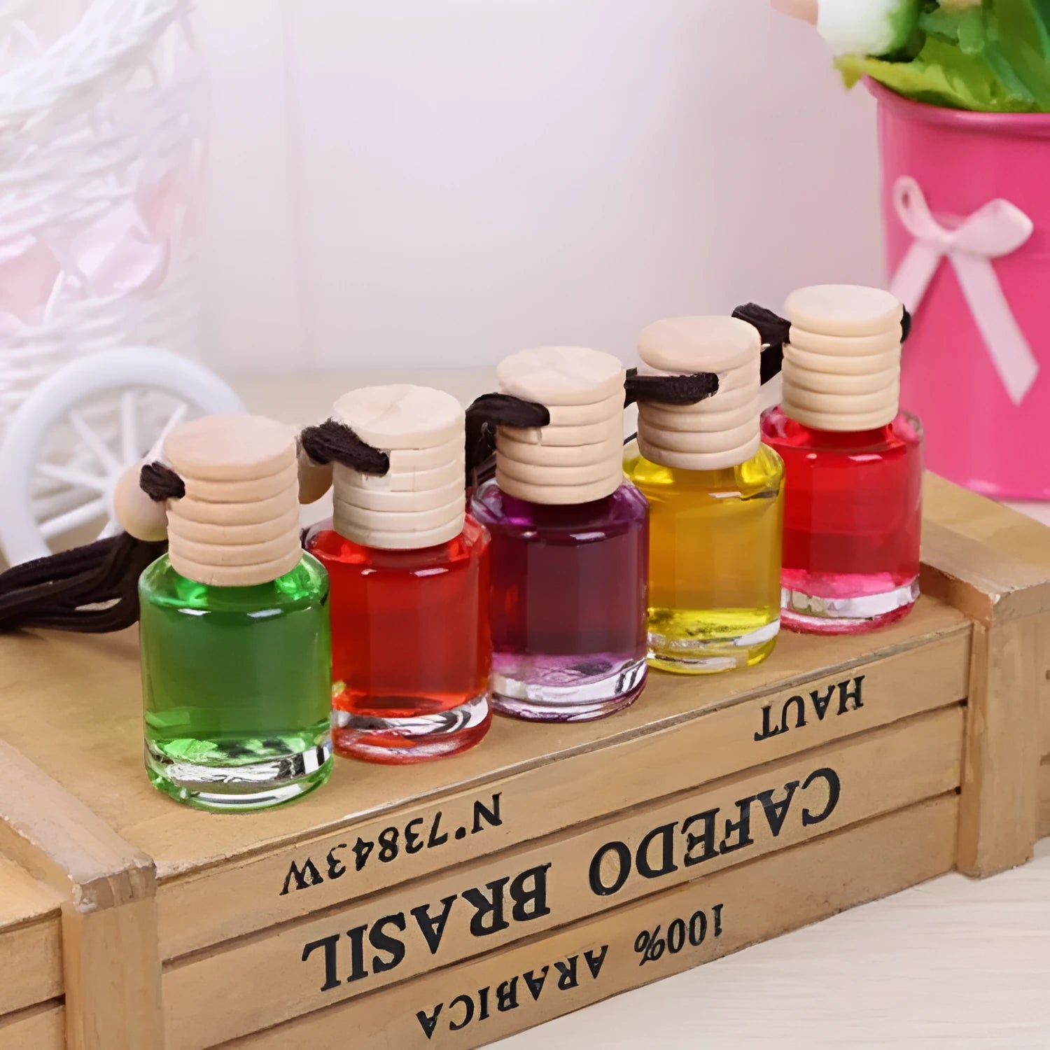 Glass bottle car air freshener hanging ornament with six fragrance refill options displayed