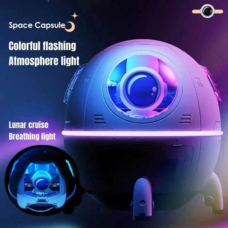 Light purple astronaut-shaped USB desktop humidifier with colourful LED light on a desk.