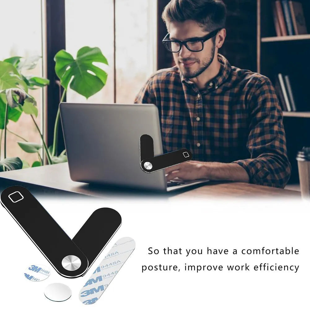 Black aluminium magnetic phone holder mounted on side of laptop screen.