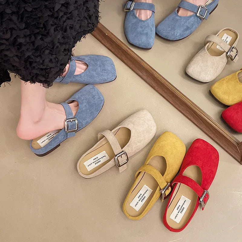 Women's flat closed-toe slippers with square toe in blue, showing PU upper and rubber sole.