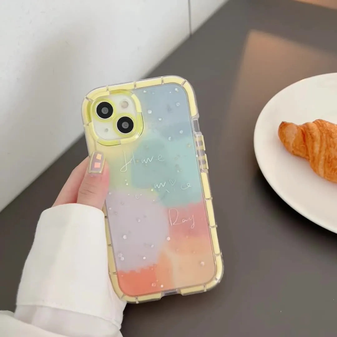 Minimalist two-tone silicone iPhone case with a yellow edge, shown on a phone.