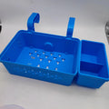 Plastic swimming pool edge hook storage basket in blue holding towels and books poolside