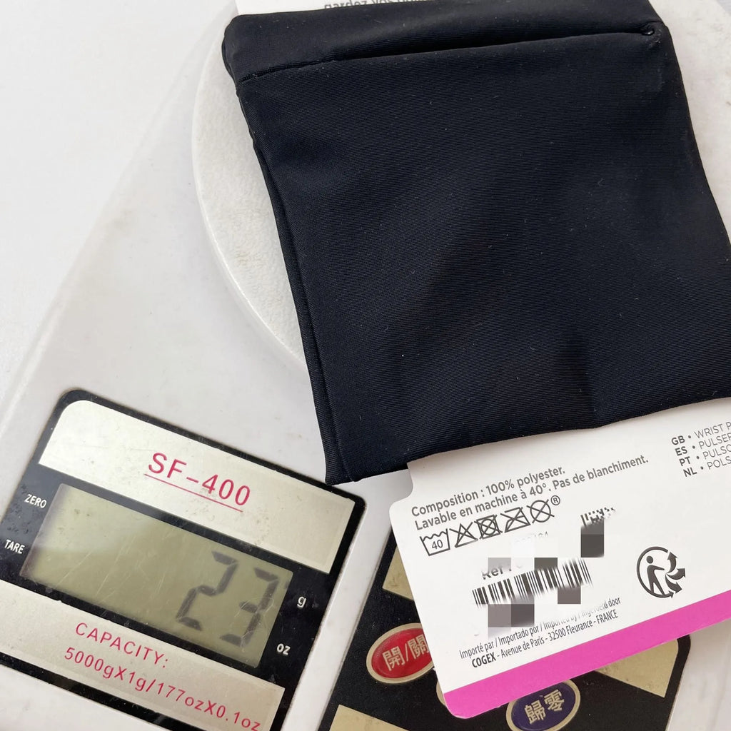 Adjustable fitness wrist bag with armband sleeve for mobile phone, shown in packaging.