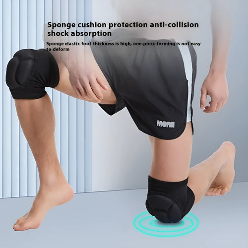 Pair of black thick sponge knee pads for sports protection on a neutral background