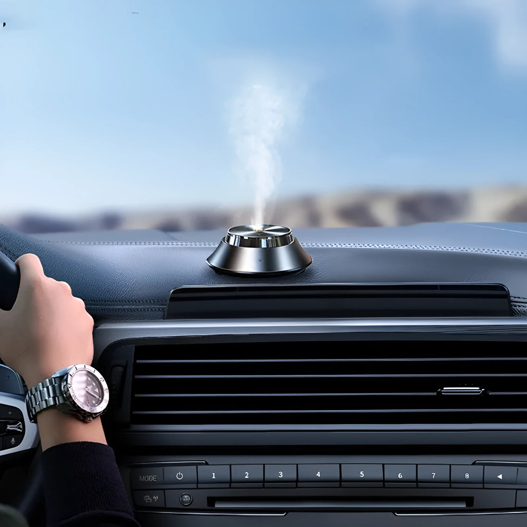 Intelligent black metal Butterfly design car aromatherapy air purifier with USB cable and essential oil bottle.