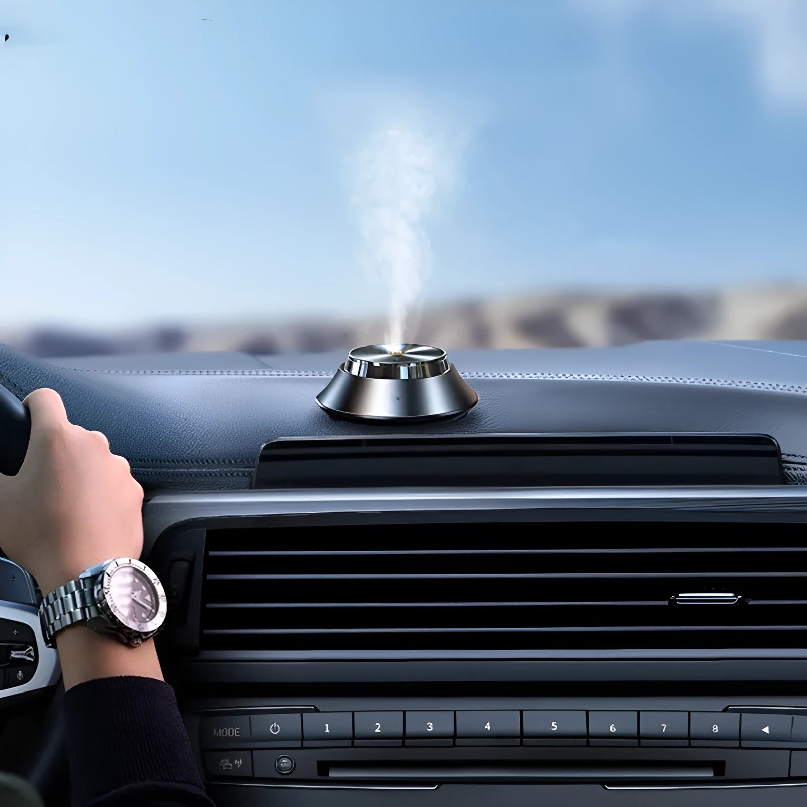 Intelligent black metal Butterfly design car aromatherapy air purifier with USB cable and essential oil bottle.