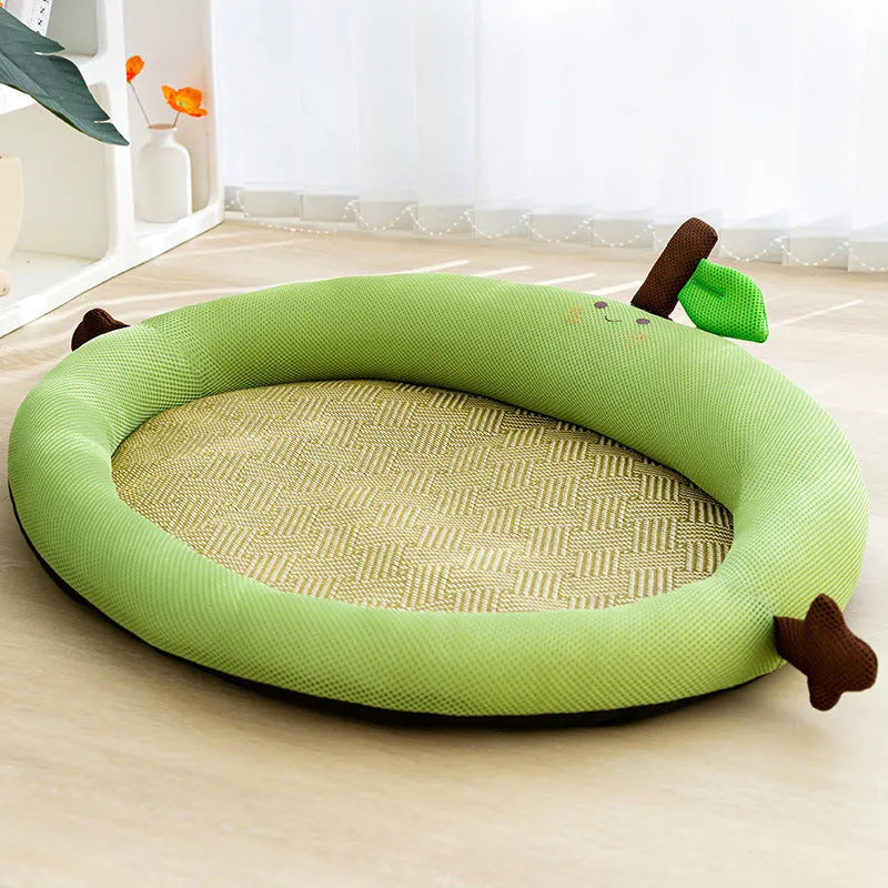 Green fruit-shaped pet nest mat with raised backrest for a cat or small dog.