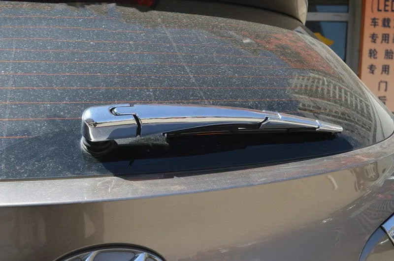 Set of four silvery ABS plastic rear window wiper cover trims for 2010 Hyundai models.