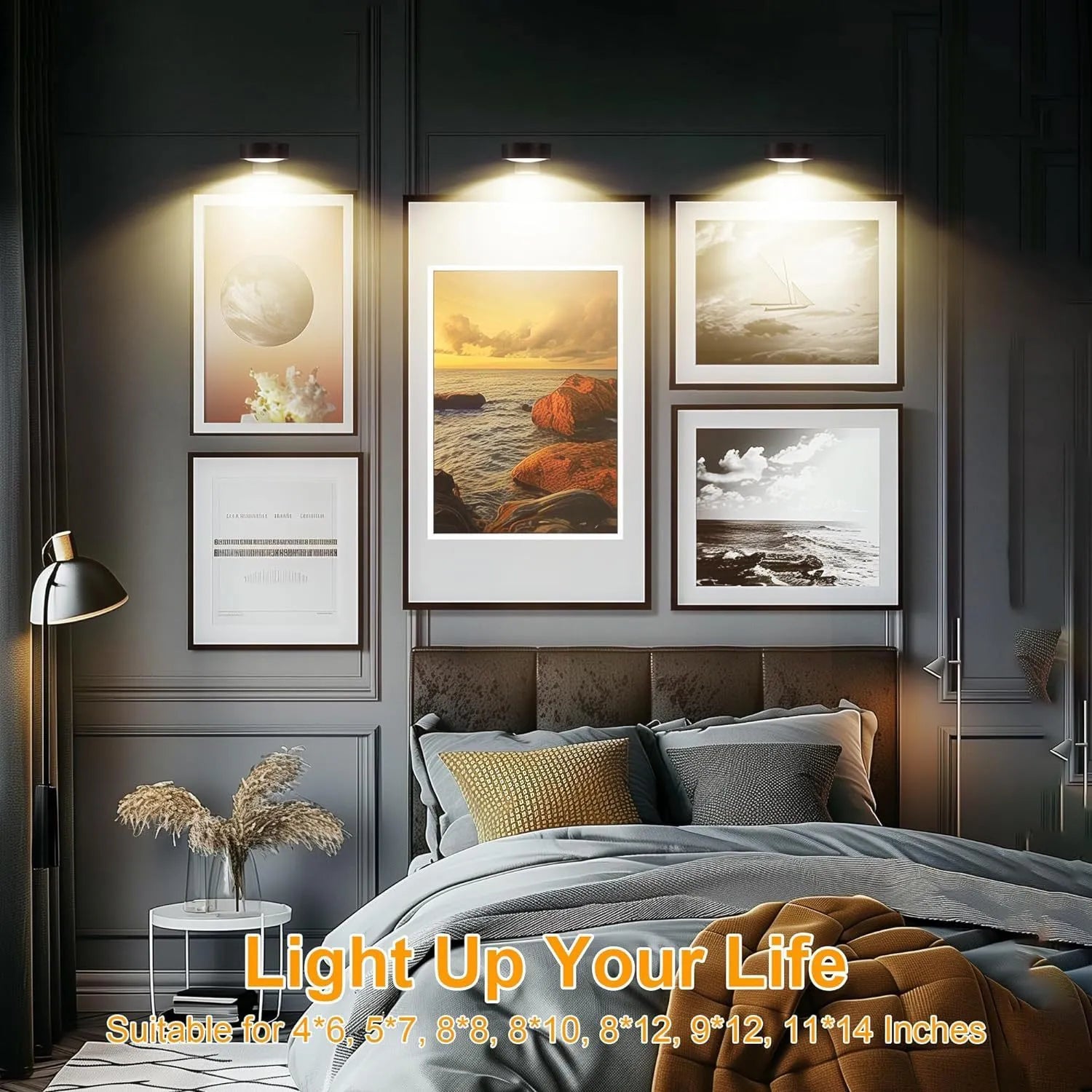 Black magnetic wireless LED lamp with remote control mounted next to a painting on a wall.