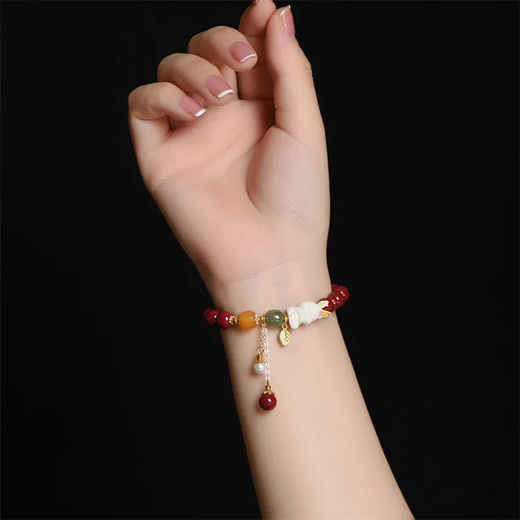 Natural cinnabar bracelet with rabbit design in traditional Chinese style