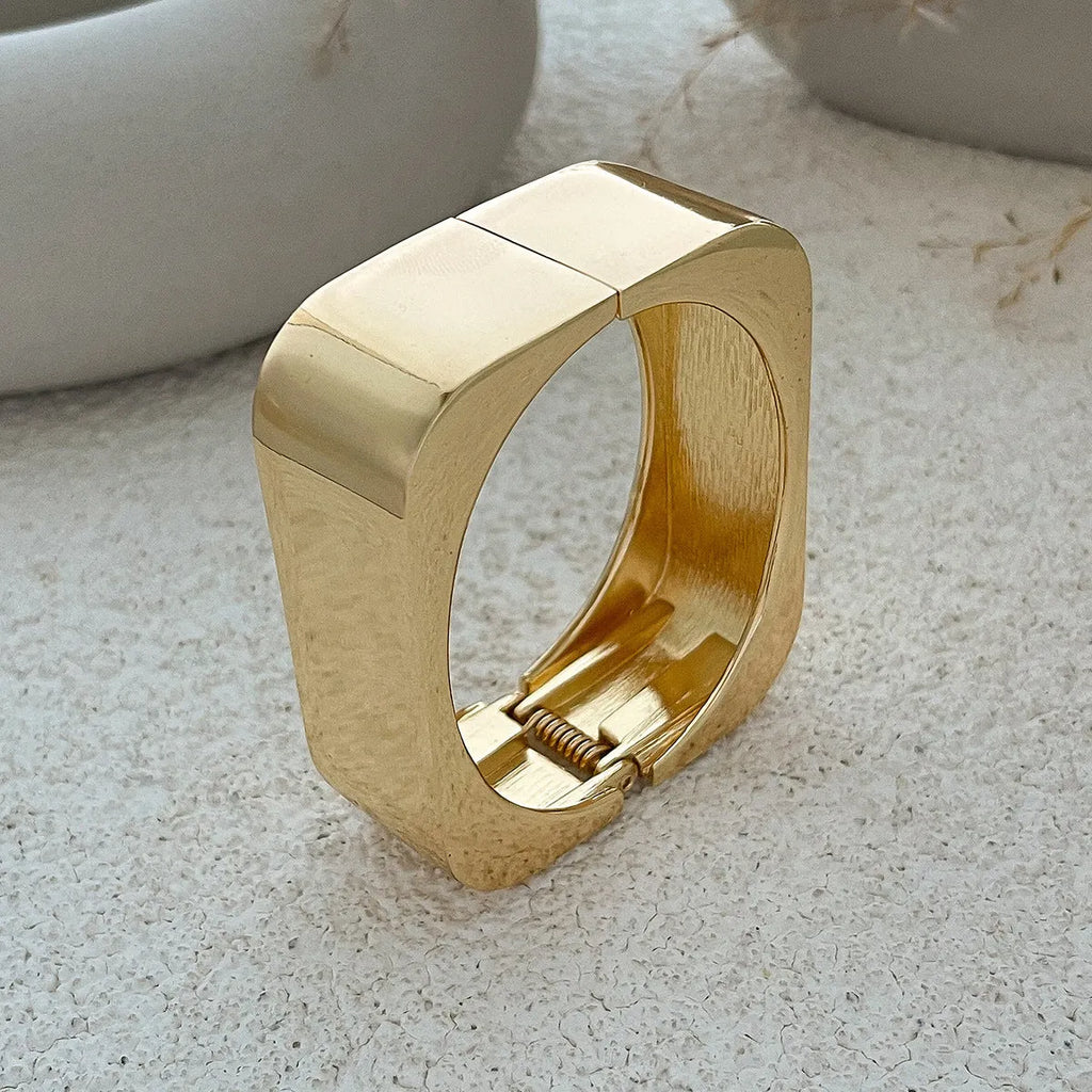 Geometric square mirror bracelet with glossy electroplated alloy finish in Gold or Silver Sweep colour