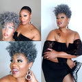 Short black synthetic wig with simple rolled hairstyle, made from Kanekalon fibre.