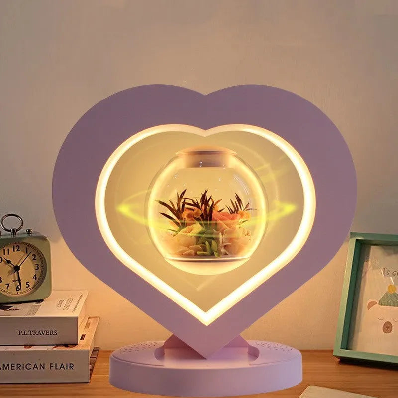 Pink preserved rose ornament with LED lights on a base, with optional audio Bluetooth for music.
